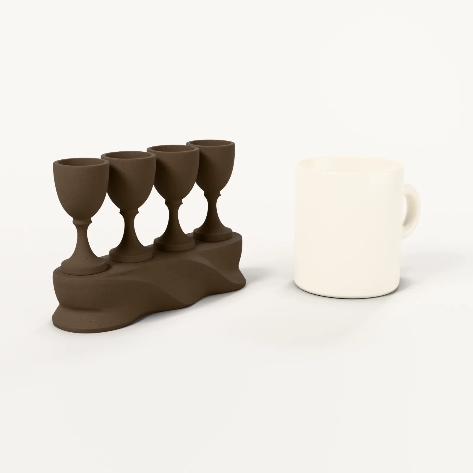 Skulptur Vier Becher, Größenvergleich mit einer Kaffeetasse